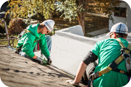 solar-panel-installation-crew-members-on-roof-of-h-2023-11-27-04-50-20-utc (1)